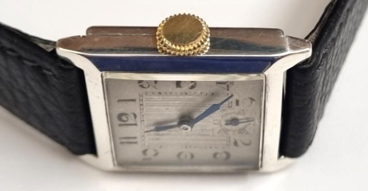 Swiss Officers style manual wind tank watch in a silver case with import hallmark for Edinburgh 1929 on a black leather strap with silvered buckle. Silvered dial with black hours and minute track with blued steel hands and subsidiary seconds dial. Unsigned 15 jewel engine turned decorated movement with case back stamped 'A.G.R' and numbered 264741.