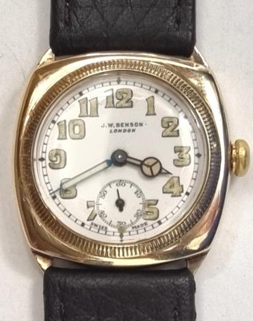Swiss made J.W.Benson hand wind wrist watch in a 9ct gold case made by Francois Borgel and with Glasgow import hallmark for c1932 on a brown leather strap with gilt buckle. Signed white dial with black luminous infilled numeric hours and matching hands with subsidiary seconds dial. Swiss Cyma calibre 010 adjusted 16 jewel jewelled lever movement with split bi-metallic balance and overcoil hairspring and numbered 582272 with 'SFC' case back numbered 0169984.