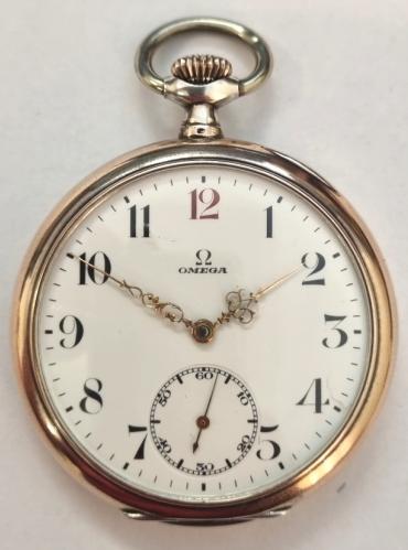 Swiss Omega open face pocket watch c1900 with top wind and time change in a 0.800 silver case with Swiss proof marks and gilt edging to bezel and case back. Signed white enamel dial with black Arabic hours and red '12' with ornate gilt hands and subsidiary seconds dial at 6 o/clock. Swiss Omega signed jewelled lever movement calibre 19LB with split bi-metallic balance and overcoil hairspring, numbered 6009698 with signed case back numbered 6799260.