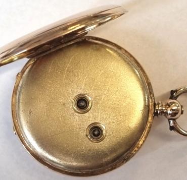 Swiss Stauffer, Son & Co of La Chaux-de-Fonds half hunter fob pocket watch in a 14K gold case with key wind and time change c1880. Black Roman hours on the outer case and internal white enamel dial with black Roman hours and blued steel hands with subsidiary seconds dial at 6 o/c. Signed Swiss key wound cylinder movement with case back numbered 66352 and bearing a decorative external monogram inscription.