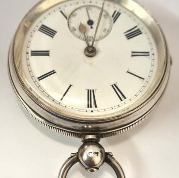 English full plate lever pocket watch by William Erhardt in a silver case hallmarked for Birmingham c1903, signed 'WE' and numbered 542573. Key wind and time change with white enamel dial with black Roman hours and gilt hands with subsidiary seconds dial. Back plate numbered 542573 with full plate lever movement with decorated cock piece and split bi-metallic jewelled balance. Case Diameter - 52mm.