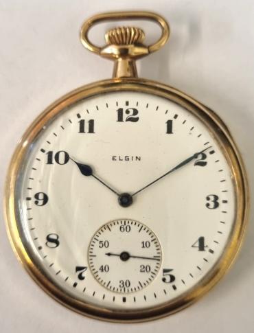 American Elgin National Watch Co., pocket watch with top wind and time change in a gold plated case c1920. Signed white enamelled dial with black hours and blued steel hands and subsidiary seconds dial at 6o/c. Elgin National Watch Company signed and engine turning decorated grade 315 15 jewel jewelled lever movement with split bi-metallic balance and overcoil hairspring incorporation a micro-regulator and numbered 22061711 with case back inscribed 'CASE B&B ROYAL 20 YEARS' and indistinctly numbered.