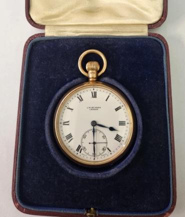 Swiss J.W.Benson of London pocket watch with top wind and time change in a 9ct gold Dennison case hallmarked for Birmingham c1928. Signed white enamelled dial with black Roman hours and blued steel hands with subsidiary seconds dial at 6o/c. Swiss made J.W.Benson signed 15 jewel jewelled lever movement with split bi-metallic balance and overcoil hairspring with Dennison case back numbered 441448 and complete with original presentation blue plush velvet case.