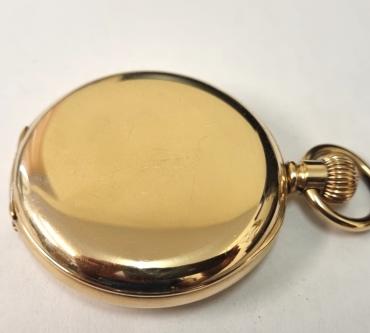 American Waltham Watch Co., full hunter 'Traveler' pocket watch circa 1900 in a gold plated Dennison case numbered 43887. Top wind and time change with plain outer case over a signed white enamel dial with black Roman hours and gilt hands with a subsidiary seconds dial at 6 o/c. Signed American Waltham 7 jewel jewelled lever movement with split bi-metallic balance and overcoil hairspring and numbered 12172893.