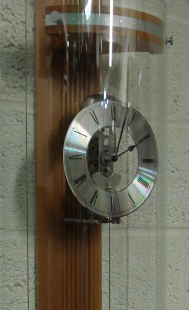Ultra modern style impressive brand new 8 day bell striking clock by Billib. Double weight driven, pendulum movement, pine cased with a curved glass front. Case height - 64".