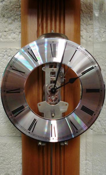 Ultra modern style impressive brand new 8 day bell striking clock by Billib. Double weight driven, pendulum movement, pine cased with a curved glass front. Case height - 64".
