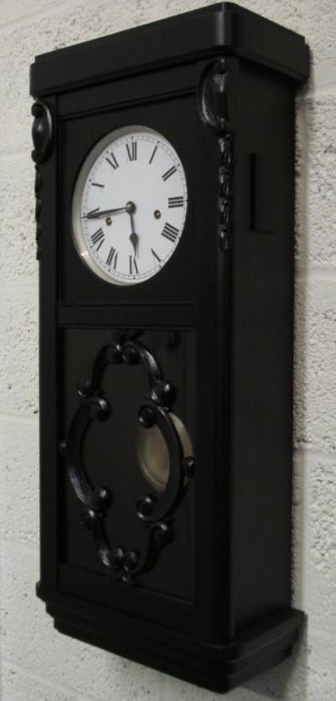 Black stained oak wood cased 8 day Westminster chime wall clock by Winterhalder and Hofmeier. Refurbished white painted dial, black roman numerals with black painted steel hands. Spring driven, pendulum movement dating from the 1920's.