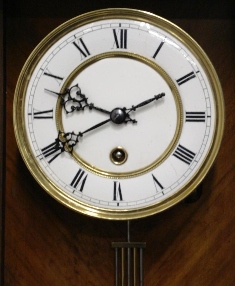 Good quality Vienna Regulator style wall clock attributed to Lenzkirch and circa 1870. Typical decorative pine and mahogany veneer casework housing an 8 day 'A' frame spring driven movement stamped TH and numbered 153392. White enamel dial with brass bezel and black roman numerals with ornate black painted steel hands.