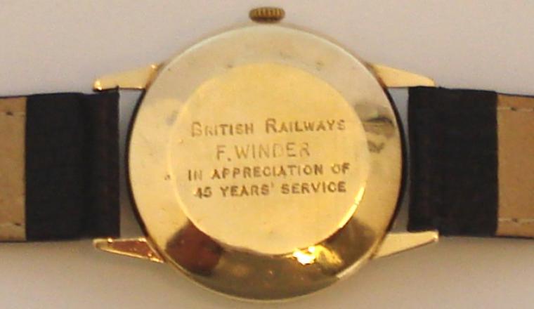 Bernex 9ct gold wrist watch with Bernex signed manual wind swiss incabloc 17 jewel movement, on a black leather strap. Silver coloured dial with gilt arabic hour markers and matching gilt hands with subsidiary seconds dial at 6 o/c. The case back records the presentation to F.Winder by British Railways in appreciation for 45 years service and is stamped DS&S and numbered 05013 and bears the mark for Girard Perregaux 1791.