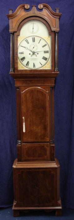 Flame mahogany and boxwood inlay cased longcase clock, with painted face and swan neck hood with fluted pillars. Bell striking, 8 day movement, with seconds indication and date display, together with 'strike / silent' capability. Dial signed W. HERBERT, LUDLOW, and clock manufacture date c1840.