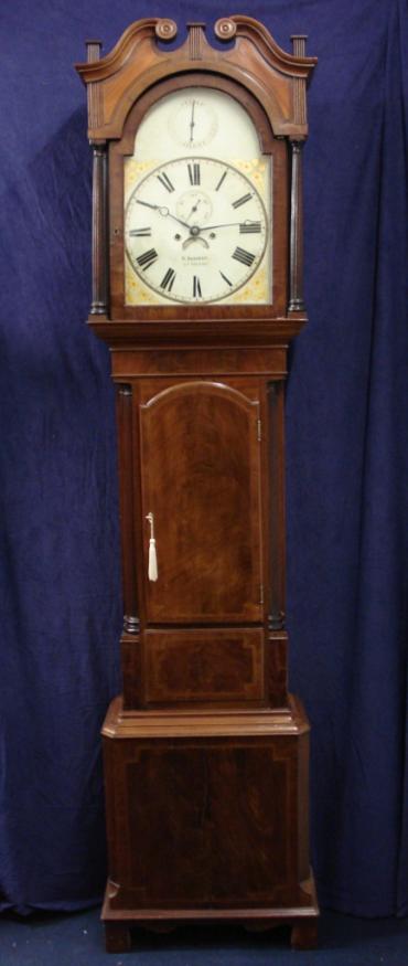 Flame mahogany and boxwood inlay cased longcase clock, with painted face and swan neck hood with fluted pillars.  Bell striking, 8 day movement, with seconds indication and date display, together with 'strike / silent' capability.   Dial signed W. HERBERT, LUDLOW