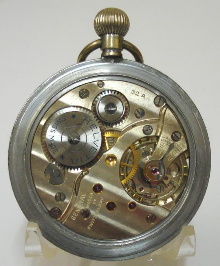 Swiss Helvetia chromed case ex-military pocket watch with top wind and time change. White enamel dial with black arabic hours and blued, luminous insert, steel hands and subsidiary seconds dial at 6 o/c. Swiss General Watch Co. manual wind lever movement with over-coil hair spring, the watch case back inscribed with the broad arrow mark and 'GS/TP P28656' and the whole housed in an external dust resistant two part case.