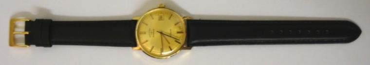 Swiss Rotary automatic wrist watch in a gold plated case with stainless steel back on a black leather strap with gilt buckle. Brushed gilt dial with gold and black baton hour markers and matching hands with black sweep seconds hand and date display at 3 o/c. Swiss 21 jewel incabloc AS 2063 automatic movement.