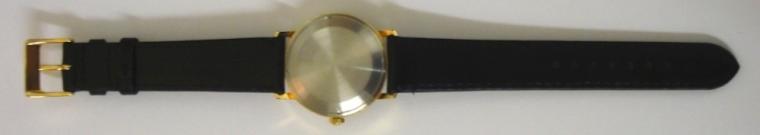 Swiss Rotary automatic wrist watch in a gold plated case with stainless steel back on a black leather strap with gilt buckle. Brushed gilt dial with gold and black baton hour markers and matching hands with black sweep seconds hand and date display at 3 o/c. Swiss 21 jewel incabloc AS 2063 automatic movement.