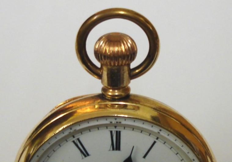 Unsigned English gold plated pocket watch in a Dennison 'Star' case. White enamel dial with black roman hours and blued steel hands with a subsidiary seconds dial. Jewelled lever movement with split bi-metallic balance and overcoil hair spring and stamped 'Made in England' and numbered #829487 with case number #190041.