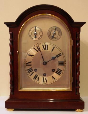 Mahogany case with decorative 'barley twist' columns. Silvered dial with chime/silent function and fine regulating time adjuster, surrounded by brass bezel with bevelled glass. 8 day Westminster chiming movement c1900.