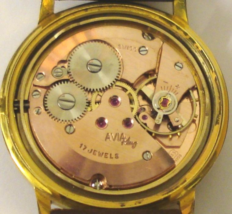 Swiss Avia Olympic manual wind wrist watch in a gold plated case with stainless steel back, on a brown leather strap with gilt buckle. Silvered dial with gilt baton hour markers and matching gilt hands with sweep seconds hand and date display at 3 o/c. Signed 17 jewel Avia King AS1703 movement with screw on case back numbered #5811 & 6118.