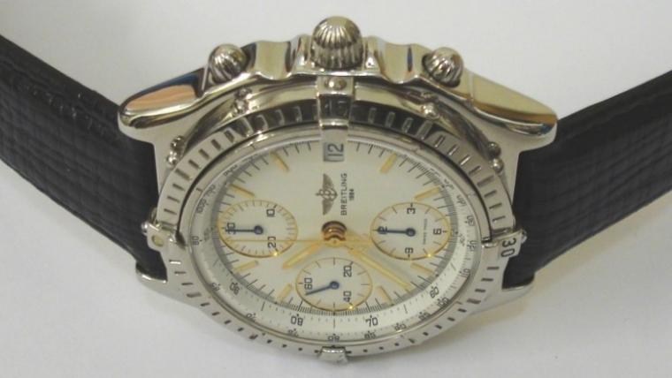 Breitling Automatic Chronograph in a stainless steel case on an original black leather strap. Sapphire crystal over a white dial with gilt and luminous baton hour markers and matching hands with a subsidiary seconds dial and date display at 3 o/c. 12 hour chronograph time recording via the sweep seconds hand and subsidiary hours and minutes dials. Screw down crown and case back with signed 25 jewel calibre 7750 Valjoux movement.