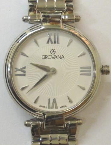 Brand new mid-size quartz wrist watch by Grovana in an all stainless steel case with integral bracelet. Sapphire crystal over a white textured dial with polished silvered hours and matching hands. Brand new model 4576.1LE watch number 1132 water resistant to 30 metres complete with box, all paperwork and manufacturer's guarantee.