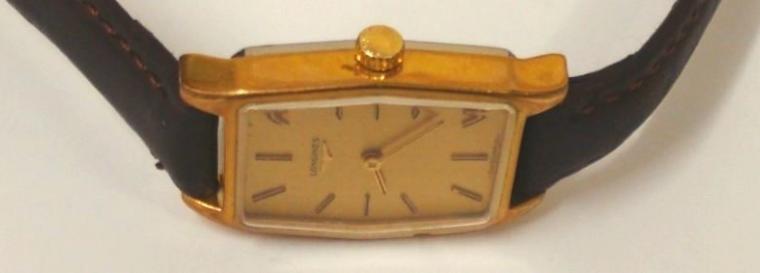 Ladies Longines wrist watch with manual wind 17 jewel movement circa 1960, housed in gold plated case with stainless steel back and brown leather strap. Gold coloured dial with gilt baton hour markers and matching hands. Case back internally numbered 817 10652 with signed Longines L3214 movement numbered 53335527.