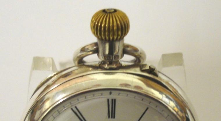 English silver cased open face pocket watch maker unknown, hallmarked for Chester c1897. White enamel dial with black Roman hours and gilt hour and minute hands. Top wind and rocking bar time change movement numbered #16695 with decorated cock piece and jewel end stone.