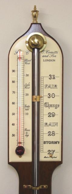 Modern Comitti of London mercury stick barometer with red alcohol Fahrenheit and Centigrade thermometer in a mahogany case with brass finial and circular bottom mercury reservoir.  Dimensions: - Height 36", width 3", depth 1.5".