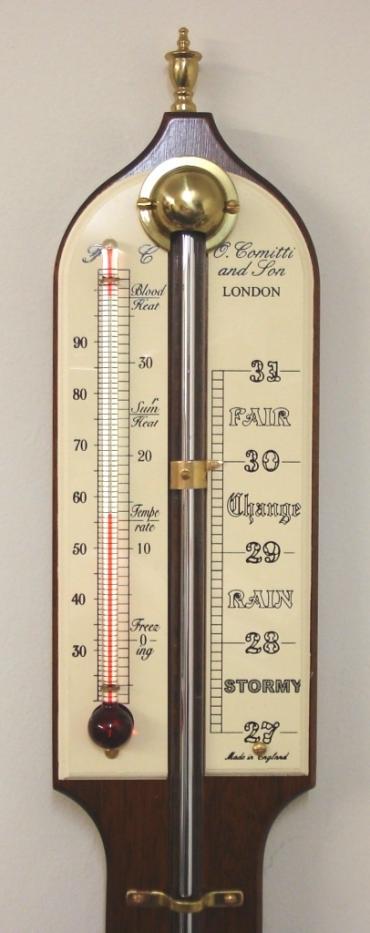 Modern Comitti of London mercury stick barometer with red alcohol Fahrenheit and Centigrade thermometer in a mahogany case with brass finial and circular bottom mercury reservoir.  Dimensions: - Height 36", width 3", depth 1.5".