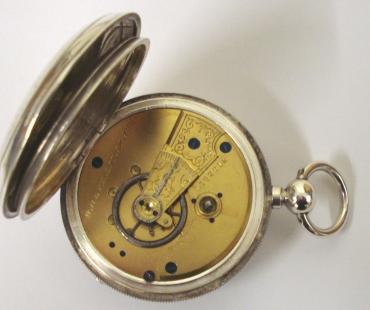 American Waltham silver cased lever pocket watch with Birmingham hallmark for 1881, case numbered #31957. Key wind and time change with white enamel dial and black Roman hours with gilt spear and shaft hands and subsidiary seconds dial. Back plate signed and numbered #1.762014 with engraved cock piece and jewelled end stone.