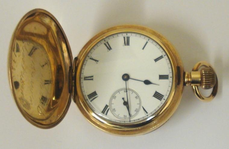 American Waltham Traveler full hunter pocket watch in a gold plated Dennison case with top wind and time change. White enamel dial with black Roman hours, black steel hands and subsidiary seconds dial. Jewelled lever movement with split bi-metallic balance and overcoil hairspring. Dennison case number #72339 and signed movement number #12386783 circa 1903.