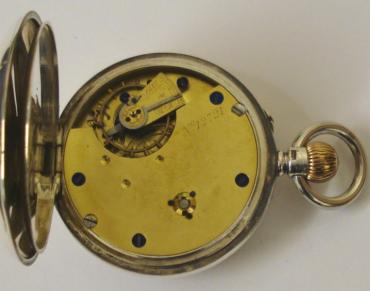 English silver cased open face pocket watch by the Lancashire Watch Company with top wind and rocking bar time change. White enamel dial with black Roman hours, blued steel hands and subsidiary seconds dial. Three quarter plate jewelled lever movement with split bi-metallic balance and overcoil hairspring and numbered #12721 with case numbered #737 and hallmarked for Chester circa 1895.
