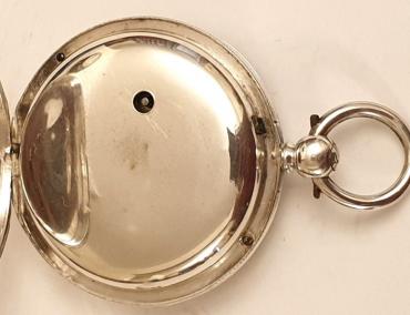 English silver cased key wound fusee lever pocket watch with London hallmark for circa 1850. Silver engine turned and floral engraved dial with gilt Roman hours and blued steel spade hands with subsidiary seconds dial at 6 o/c. Decoratively engraved cock piece with diamond end stone and unsigned back plate numbered #11091 with the number repeated on the case interior.