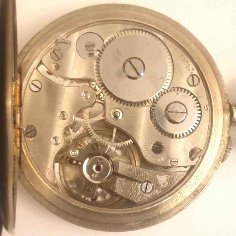 Swiss silver plated pocket watch by Baume and Co. circa1920s. Top wind and rocking bar time change with white enamel dial and black Roman hours with black steel hands and a subsidiary seconds dial at 6 o/c. Signed seven jewel lever movement with bi-metallic balance with case back internally signed and numbered #729028.