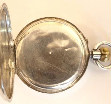 Swiss silver cased pocket watch, maker unknown circa 1910. Top wind and rocking bar time change with white enamel dial and black Roman hours with blued steel hands and subsidiary seconds dial at 6 o/c. Swiss cylinder escapement and split bar movement with case stamped '0.935' and numbered #135423.