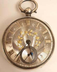 English silver cased fusee pocket watch by Cattaneo of Stockton. Key wind and time change with silver dial with engine turning and applied gold floral decoration. Gilt Roman hours with blued steel hands and subsidiary seconds dial, the silver case hallmarked for London circa 1856. Signed fusee movement with floral decorated cock piece and diamond end stone and numbered #1180 with a secondary numbering of #6992. This number is repeated with the case hallmarks which also bear a personal ownership wriggle-work inscription dated 1897.
