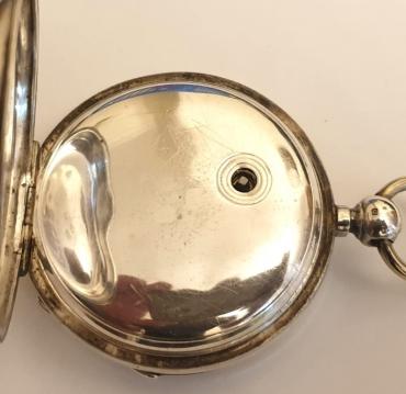 Swiss silver cased pocket watch made by the Swiss Watch Co. in an English case bearing a Birmingham hallmark for circa 1891. Key wind and time change with white enamel dial and black Roman hours with gilt hands and subsidiary seconds dial. Signed Swiss jewelled lever escapement with going barrel movement numbered #271648, the case back stamped 'LJ' and numbered #1811.