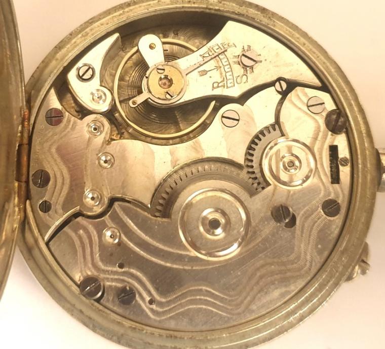 SSwiss early c20th nickel cased pocket watch with top wind and rocking bar time change. White enamel dial signed Vibrona, with black Roman hours and blued steel hands with subsidiary seconds dial at 6 o/c. Plain pin lever movement with a jewelled balance and machine decorated back plate.