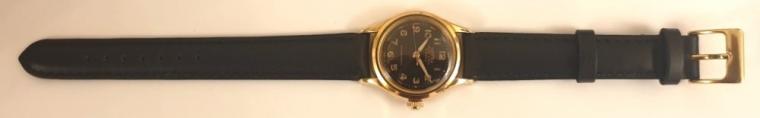 Swiss Roamer manual wind mid size wrist watch on a black leather strap with gilt buckle, circa 1950s. Gold plated case with stainless steel back numbered #215999 & 180459. Black dial with luminous Arabic hours with matching gilt hands and a sweep seconds hand. Signed Swiss 17 jewel jewelled lever movement calibre MST371.
