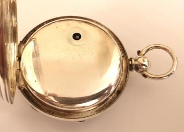 English silver cased fusee pocket watch, maker unknown. Key wind and time change with white enamel dial with black Roman hours and blued steel hands with a subsidiary seconds dial at 6 o/c, the silver case hallmarked for London circa 1864. Unsigned fusee movement with plain cock piece and a diamond end-stone with a split bi-metallic balance wheel. The silver case and cock piece are both numbered #11512.