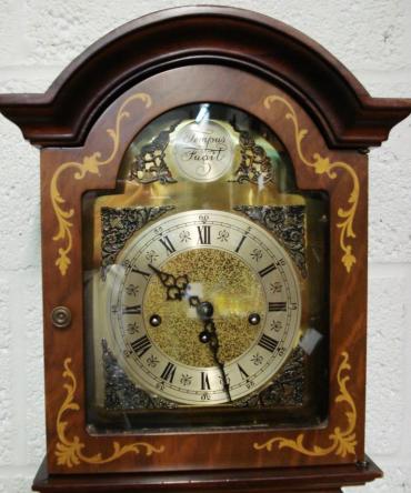 Modern 8 day Westminster Chime Longcase clock with burr walnut veneer and inlaid case. 8 day spring driven movement housed  in attractive casework with dimensions - Height 66", Width 12", Depth 8".