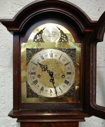 Modern 8 day Westminster Chime Longcase clock with burr walnut veneer and inlaid case. 8 day spring driven movement housed  in attractive casework with dimensions - Height 66", Width 12", Depth 8".