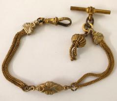 Late Victorian gold plated pocket watch chain with 't' bar, tassel and snap  8".