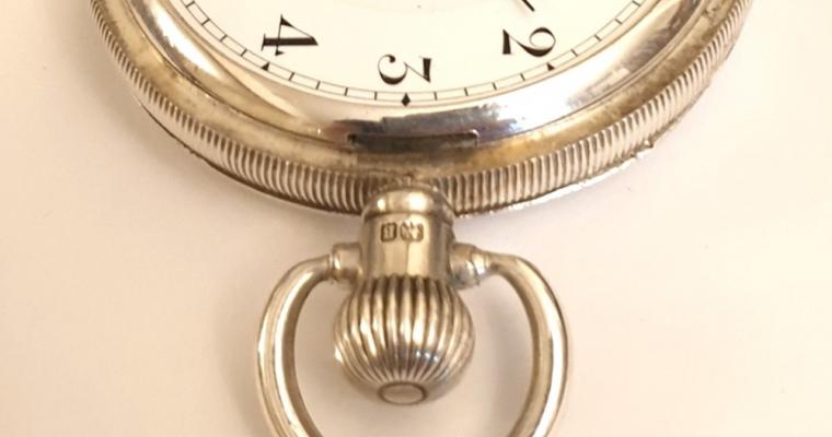Swiss silver cased full hunter pocket watch by the Datum Watch Factories with top wind and time change. White enamel dial bearing the wholesaler's designation "F W Nissen's Lifelong Lever Brisbane", with black Arabic hours, blued steel hands and subsidiary seconds dial at 6 o/c. Swiss 17 jewel negative set jewelled lever movement with split bi-metallic balance and overcoil hairspring with micro-adjuster in a Dennison silver case hallmarked for Birmingham c1926 and numbered 508481.