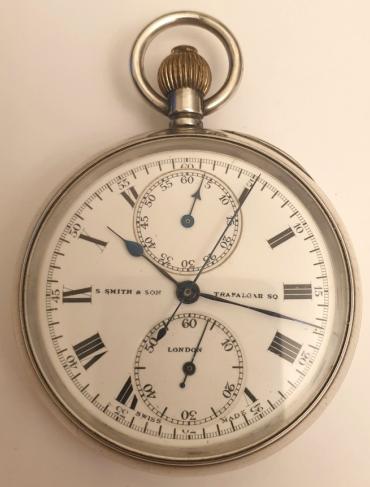 Swiss silver cased chronograph pocket watch retailed by S.Smith and Sons of London with a London import hallmark for 1918 and numbered 176136. Top wind and time change with single push chronograph activation button. White enamel dial and black Roman hours with blued steel hands and subsidiary seconds dial at 6 o/c. Sixty minute chronograph recording via the centre seconds hand and the minutes dial at 12 o/c. Swiss jewelled lever movement signed Contetout and numbered 352 - 71222, with overcoil hairspring and split bi-metallic balance and pillar wheel control system for the chronograph function.