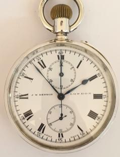 J.W.Benson silver cased chronograph pocket with Longines movement and a London import hallmark for 1910 and numbered 2224673. Top wind and rocking bar time change with single push chronograph activation button. White enamel dial and black Roman hours with blued steel hands and subsidiary seconds dial at 6 o/c. Thirty minute chronograph recording via the centre seconds hand and the minutes dial at 12 o/c. Swiss Longines calibre 19.73 jewelled lever movement with overcoil hairspring and split bi-metallic balance. Pillar wheel control system for the chronograph function with instantaneous minute recorder.