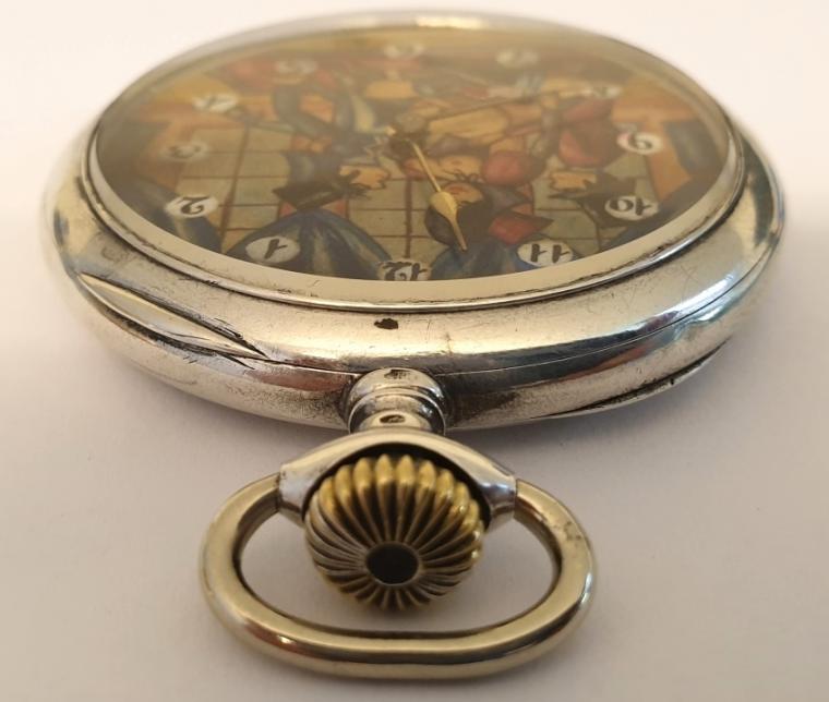 Swiss silver cased pocket watch by Doxa circa 1910. Top wind and time change with painted dial displaying an erotic scene with black Arabic hours in white surrounds and gilt hands. Signed 0.800 silver case numbered 628173 with signed jewelled lever movement with bi-metallic balance.