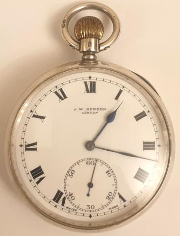 Swiss J.W.Benson silver cased pocket watch with London import hallmark for 1919. Top wind and time change with signed white enamel dial with black Roman hours and blued steel hands with subsidiary seconds dial at 6 o/c. Signed 17 jewel jewelled lever movement with split bi-metallic balance with micro regulator and inscribed 'By Warrant To HM The Late Queen Victoria' in a silver case numbered 2076555.