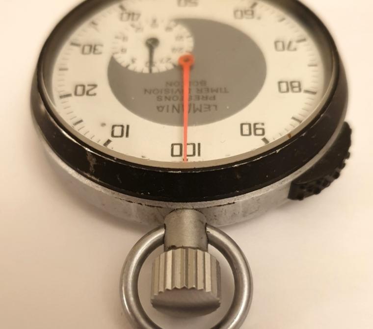 Swiss Lemania pocket stop watch for Prestons Timer Division, Bolton, in a base metal case c1960. Hand wind and return to zero function via push in crown with time recording start and stop via the black slide on the case outer. Signed dial and black Arabic outer 100 seconds register with 30 minute time recording subsidiary dial. Lemania Watch Co. movement with jewelled lever escapement and numbered 6310.