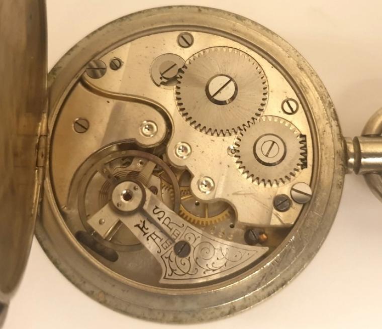 Swiss WWI 30 minute recording unsigned pocket stop watch in a nickel case. Hand wind and start, stop and return to zero functions via push in crown. White enamelled dial with black Arabic outer 60 seconds register with 30 minute time recording subsidiary dial. Swiss unsigned jewelled lever escapement.