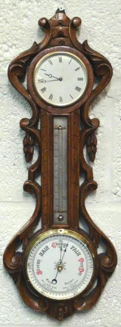 Late 19th century carved oak cased French 8 day timepiece with 'tic tac' movement, mercury thermometer, and aneroid barometer. 