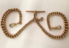 9ct rose gold pocket watch chain circa 1900 with 'T' bar, snap and decorative gold medallion fob hallmarked for Birmingham c1891.    Length 12.5", weight 26 grams.